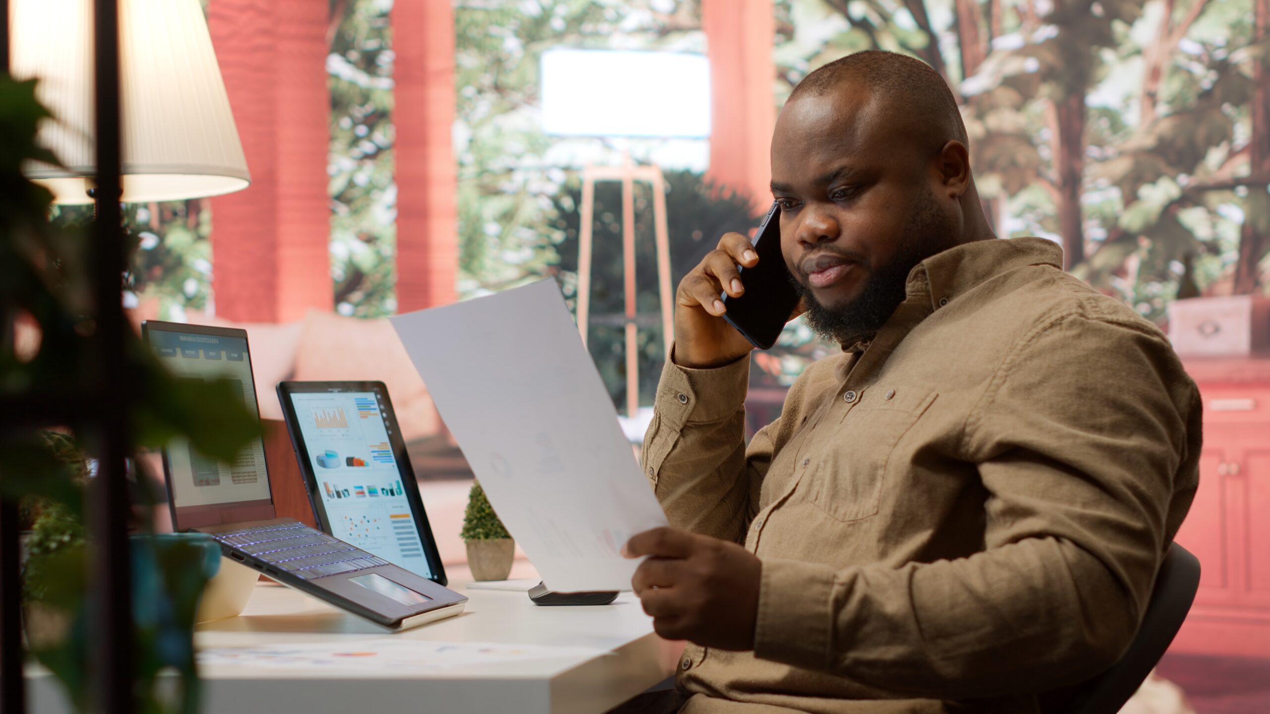 Business administrator discussing with the investors on phone call, communicating the sales numbers and performance metrics during analysis. Entrepreneur hoping to obtain new funds. Camera A.